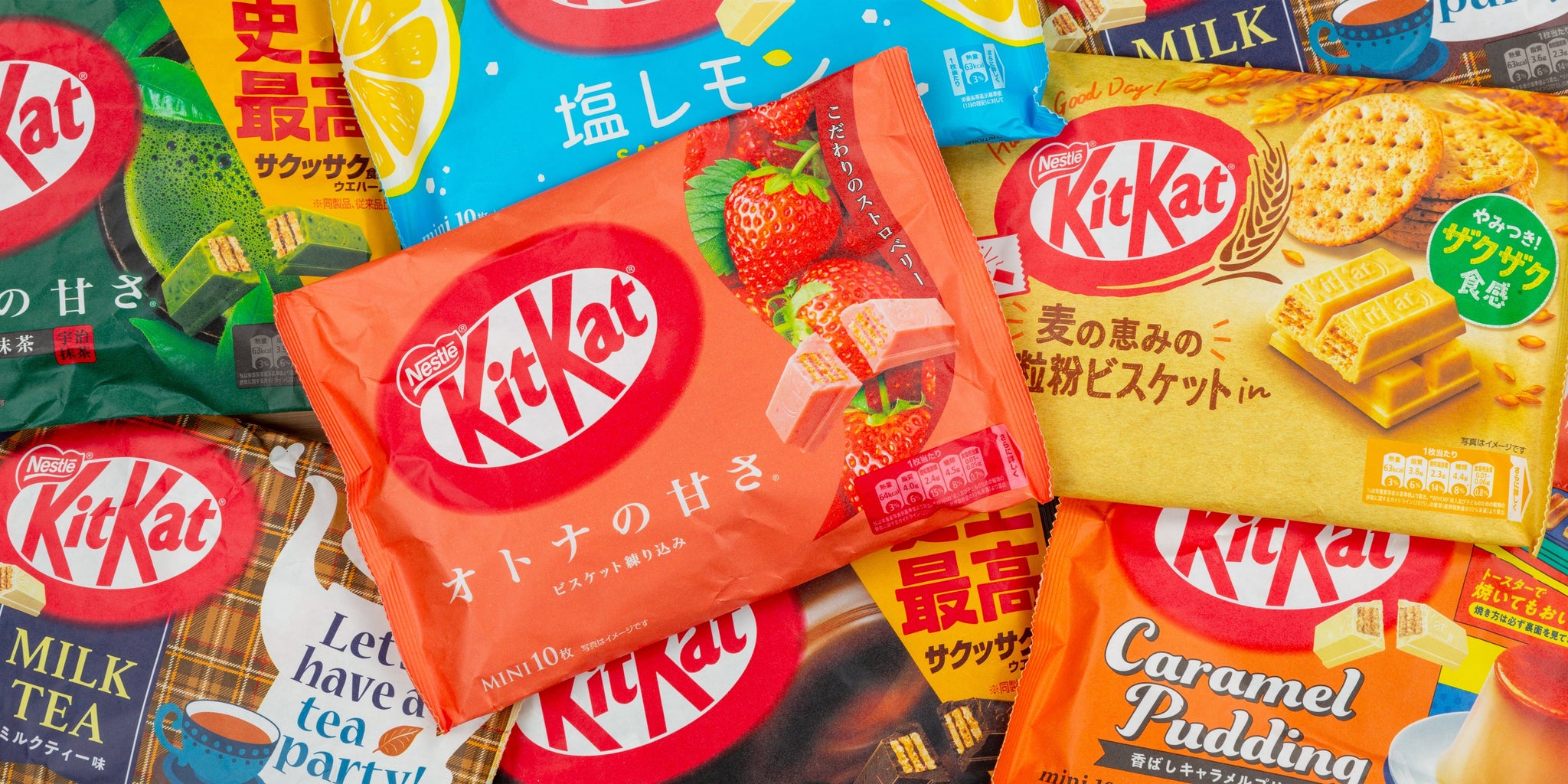 Colorful assortment of unique Kit Kat flavors including matcha, strawberry, and caramel pudding, showcasing vibrant packaging.