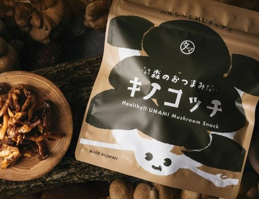 Bag of Kinokocchi Mushroom Chips with Shiitake and Eringi flavors on a wooden surface, showcasing healthy Japanese umami snack.