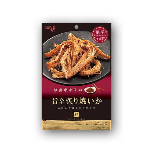 Grilled dried squid with spicy red pepper on a black plate, featuring savory charred soy sauce flavor. Contains wheat, soybean, squid.