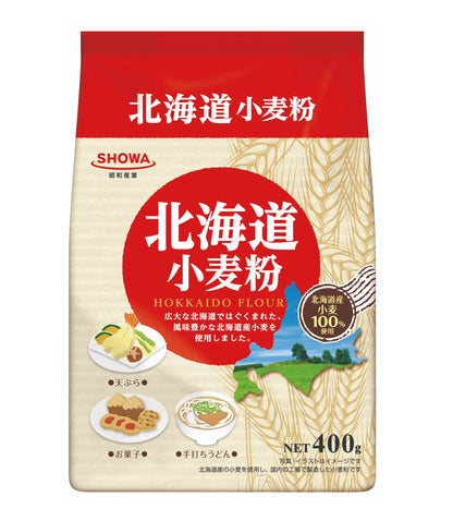 Hokkaido flour 650g packaging with okonomiyaki, barley graphics, and zipper feature for convenient storage. Contains wheat and mackerel.